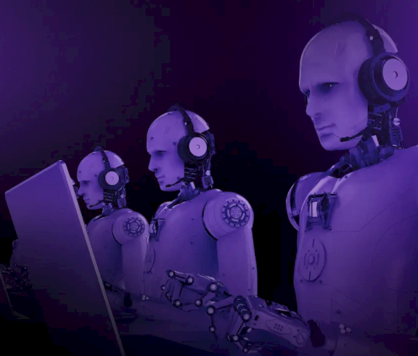 The image shows three humanoid robots wearing headsets and working on laptops, set against a purple background.