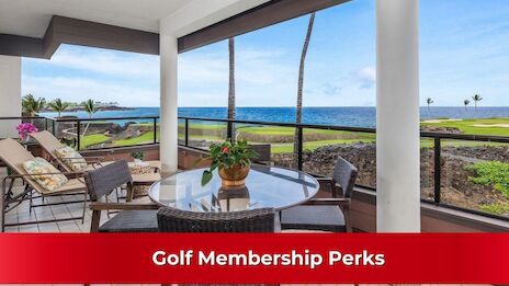 A balcony with outdoor furniture overlooks the ocean and golf course, featuring a sunny, tranquil setting with palm trees.